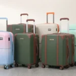 Modern rolling suitcase and luggage sets in various colors displayed together for travel.