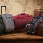 ​Best duffel bags for travel and luggage showcasing various rolling and leather designs on a wooden table with a world map background