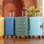 Collection of modern travel luggage suitcases in various vibrant colors